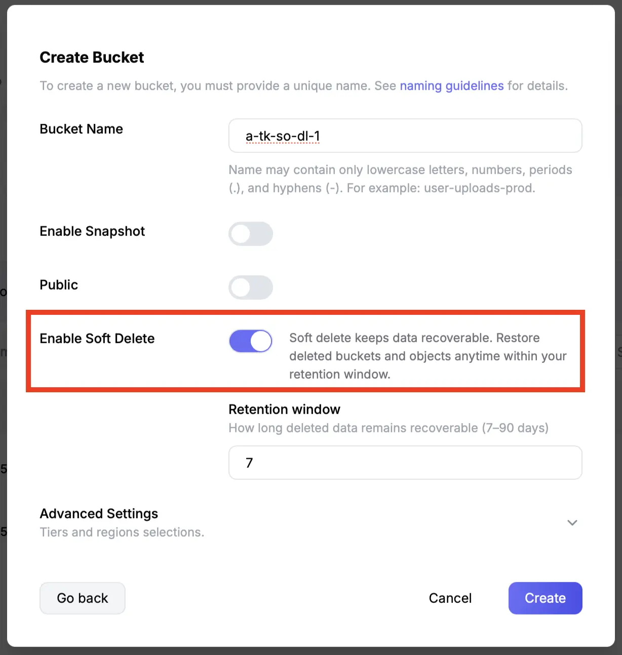 The Create Bucket dialog in the Tigris dashboard with the Enable Soft Delete toggle switched on and a retention window of 7 days set